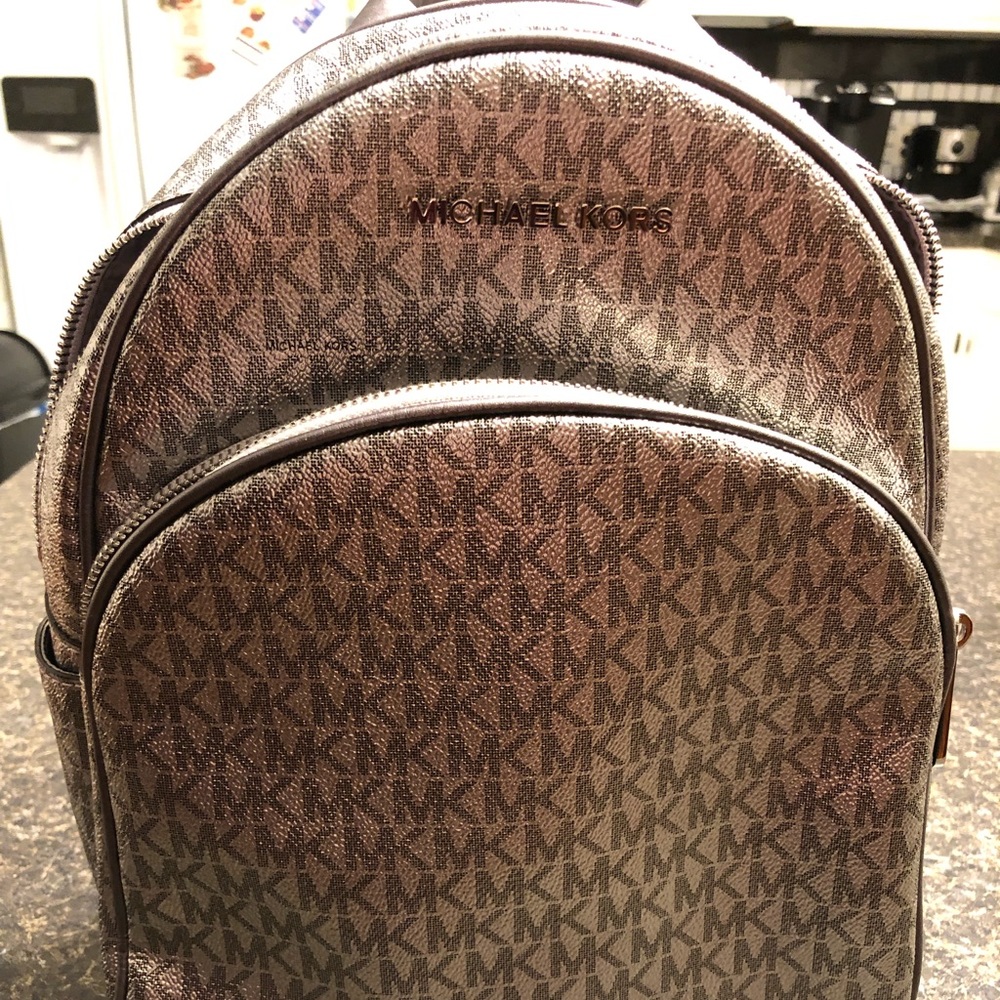 Silver Micheal Kors Authentic back pack purse